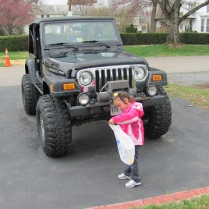 my niece in front of the jeep on easter