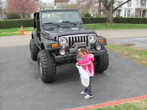 my niece in front of the jeep on easter